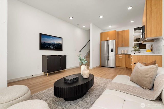 3609 Linden Ave N, Seattle, WA 98103 - living room with stairs, light wood finished floors, recessed lighting, and baseboards