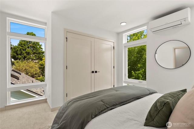 3609 Linden Ave N, Seattle, WA 98103 - carpeted bedroom featuring a wall mounted AC and a closet