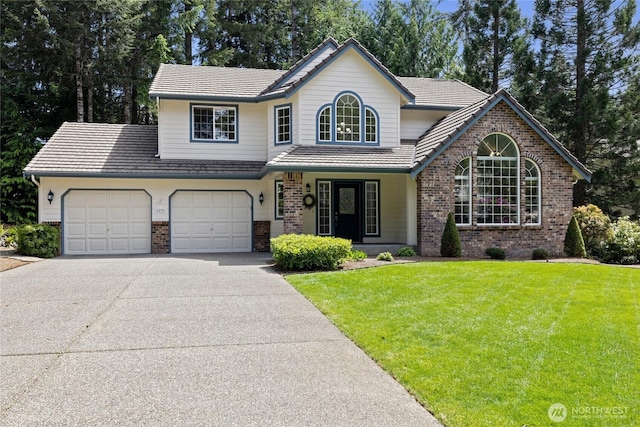 6579 Gleneagle Ave SW, Port Orchard, WA 98367 - traditional-style house with brick siding, a front yard, concrete driveway, and an attached garage