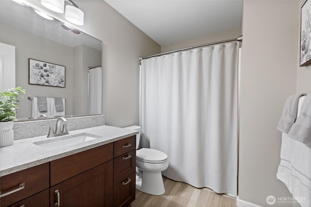 6579 Gleneagle Ave SW, Port Orchard, WA 98367 - full bath featuring vanity, toilet, wood finished floors, and curtained shower