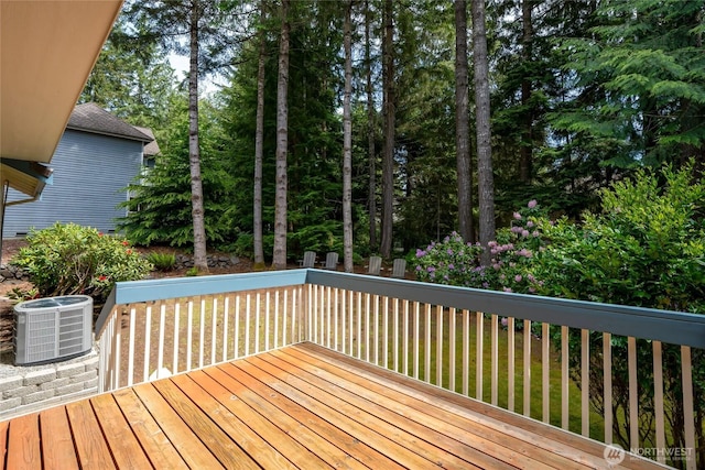 6579 Gleneagle Ave SW, Port Orchard, WA 98367 - deck featuring central AC and view of wooded area