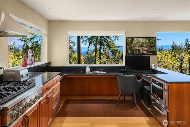 4906 157th Ave SE, Bellevue, WA 98006 - office with built in desk, light wood-type flooring, and recessed lighting