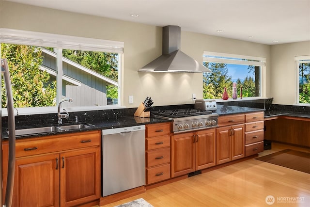 4906 157th Ave SE, Bellevue, WA 98006 - kitchen featuring appliances with stainless steel finishes, wall chimney range hood, light wood-style flooring, plenty of natural light, and recessed lighting
