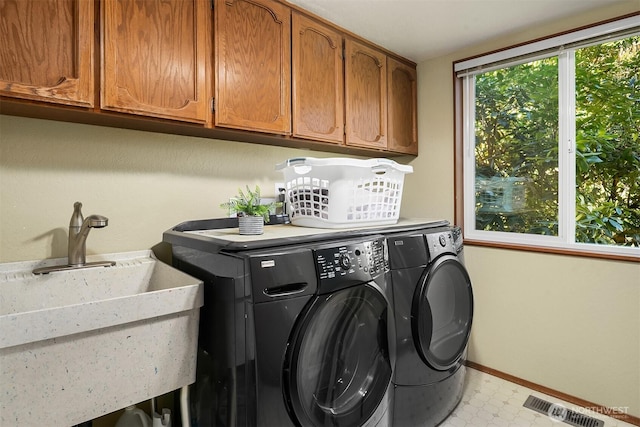 4906 157th Ave SE, Bellevue, WA 98006 - laundry area with cabinet space, washing machine and clothes dryer, light flooring, and baseboards