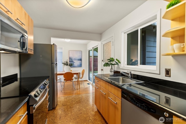 14817 Fremont Ave N, Shoreline, WA 98133 - kitchen featuring stainless steel appliances, a sink, dark countertops, brown cabinets, and light floors