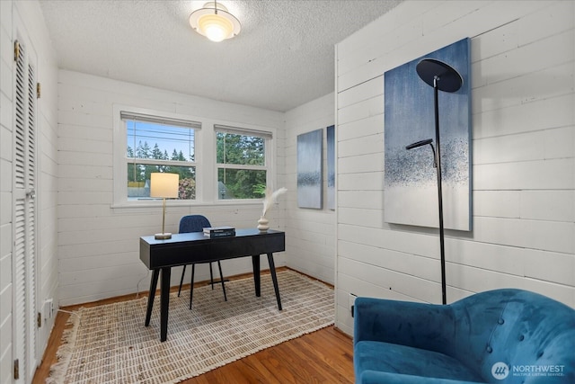 14817 Fremont Ave N, Shoreline, WA 98133 - office space with wood finished floors, a textured ceiling, and wooden walls