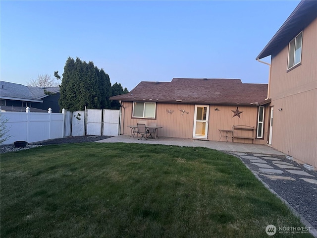 319 N Grape Dr, Moses Lake, WA 98837 - rear view of house featuring a gate and a patio area