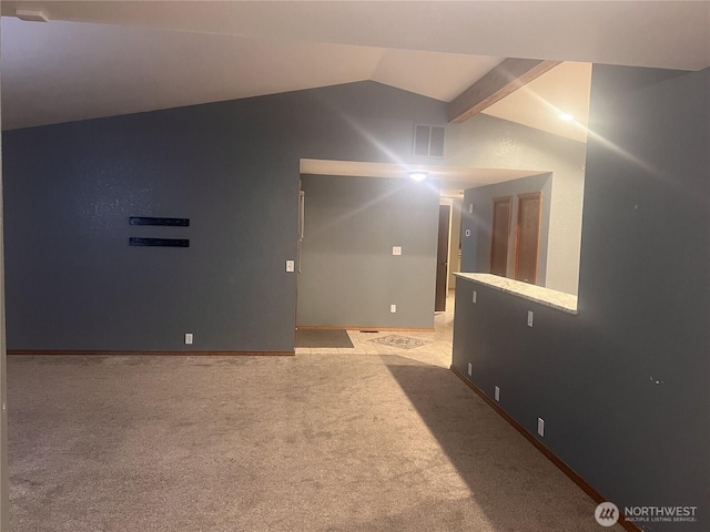 319 N Grape Dr, Moses Lake, WA 98837 - additional living space with vaulted ceiling, light carpet, and baseboards