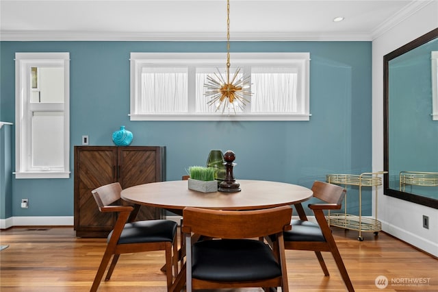 1109 30th Ave S, Seattle, WA 98144 - dining space with baseboards, a chandelier, wood finished floors, ornamental molding, and recessed lighting