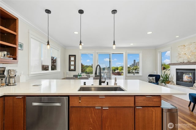 1109 30th Ave S, Seattle, WA 98144 - kitchen with stainless steel dishwasher, a sink, open floor plan, ornamental molding, and brown cabinets