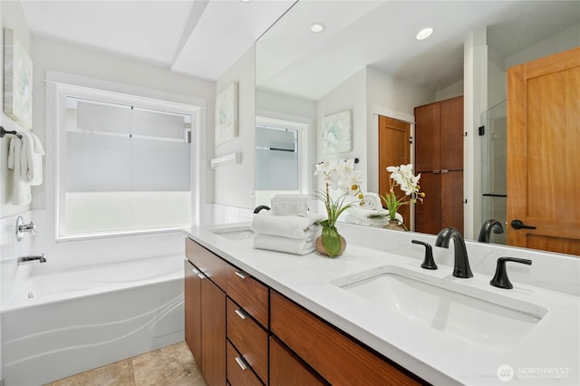 1109 30th Ave S, Seattle, WA 98144 - bathroom with double vanity, a garden tub, and recessed lighting