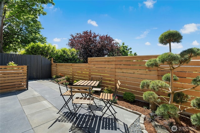 1109 30th Ave S, Seattle, WA 98144 - fenced backyard featuring a patio