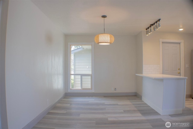 1001 Jacquelyn St, Milton-Freewater, OR 97862 - unfurnished dining area featuring baseboards, light wood-style floors, and recessed lighting