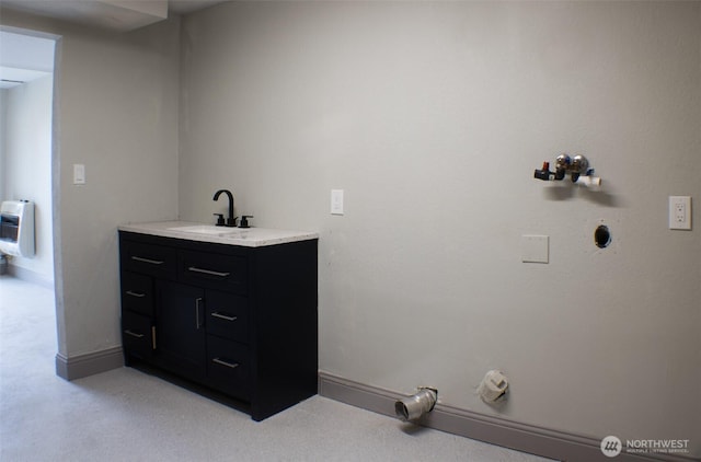 1001 Jacquelyn St, Milton-Freewater, OR 97862 - bathroom with heating unit, baseboards, and vanity