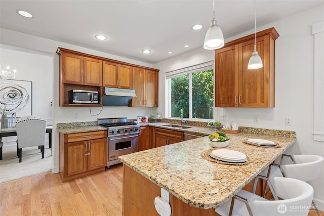 7301 NE 155th St, Kenmore, WA 98028 - kitchen with appliances with stainless steel finishes, a sink, brown cabinetry, a peninsula, and recessed lighting