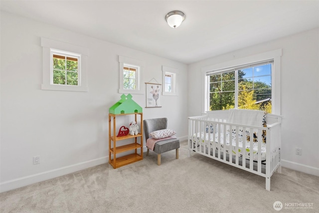 7301 NE 155th St, Kenmore, WA 98028 - carpeted bedroom featuring baseboards and a nursery area