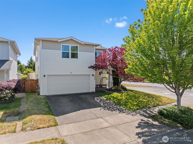 10096 Terra Glenn St SE, Yelm, WA 98597 - traditional-style house featuring an attached garage and driveway