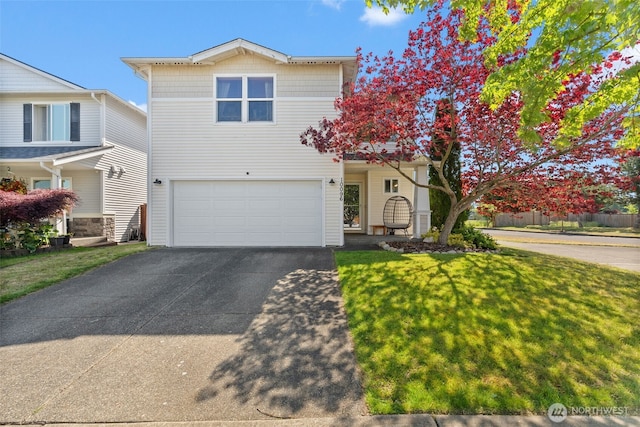 10096 Terra Glenn St SE, Yelm, WA 98597 - traditional-style home featuring driveway, an attached garage, and a front lawn