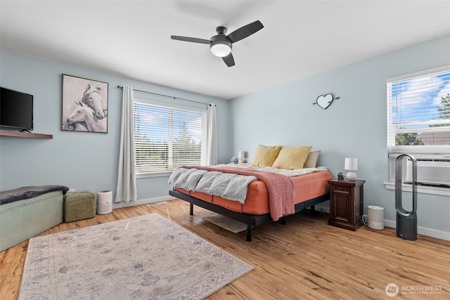 10096 Terra Glenn St SE, Yelm, WA 98597 - bedroom with multiple windows, light wood-type flooring, baseboards, and ceiling fan