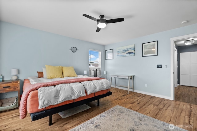 10096 Terra Glenn St SE, Yelm, WA 98597 - bedroom featuring wood finished floors, baseboards, and ceiling fan