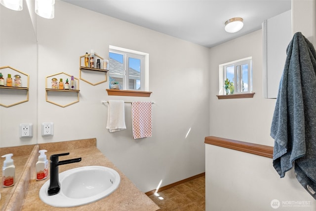 10096 Terra Glenn St SE, Yelm, WA 98597 - bathroom featuring plenty of natural light, vanity, and baseboards