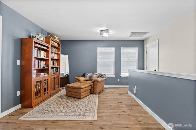 10096 Terra Glenn St SE, Yelm, WA 98597 - living area with light wood-type flooring and baseboards