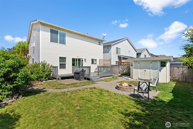 10096 Terra Glenn St SE, Yelm, WA 98597 - back of house with an outdoor fire pit and a deck