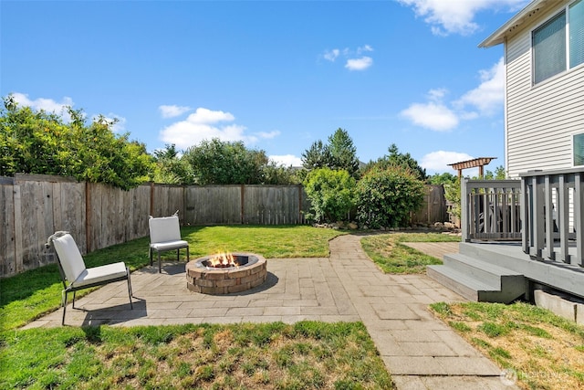 10096 Terra Glenn St SE, Yelm, WA 98597 - view of yard featuring a fire pit, a deck, and a patio area