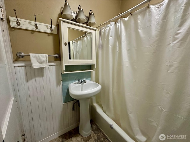 381 Trillium Ave, Forks, WA 98331 - bathroom with shower / tub combo and wainscoting