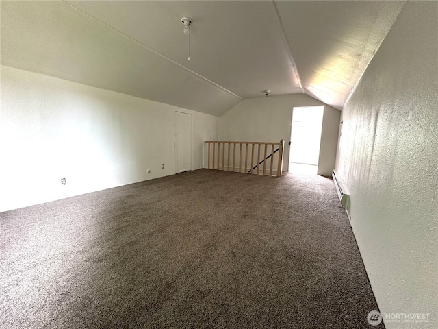 381 Trillium Ave, Forks, WA 98331 - additional living space with vaulted ceiling, a baseboard heating unit, and carpet
