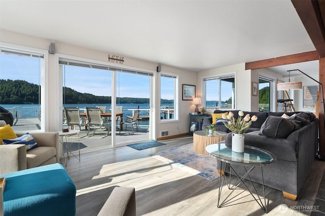 9451 E State Route 106, Union, WA 98592 - living area featuring wood finished floors, baseboards, and a water view