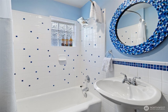 9451 E State Route 106, Union, WA 98592 - full bath featuring a sink, shower / tub combo with curtain, and tile walls
