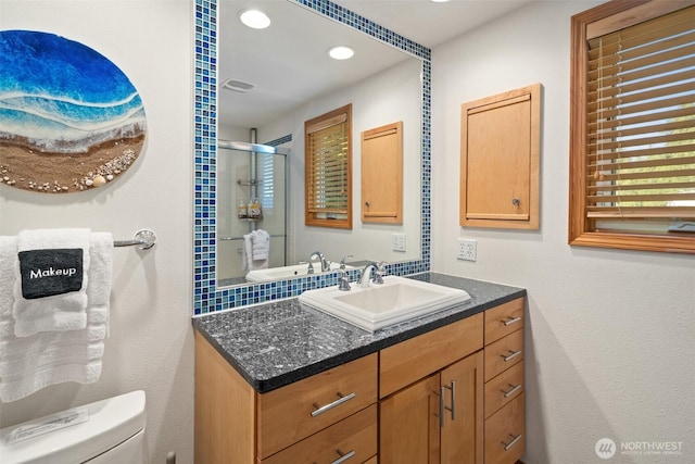 9451 E State Route 106, Union, WA 98592 - bathroom featuring toilet, vanity, a shower stall, and recessed lighting