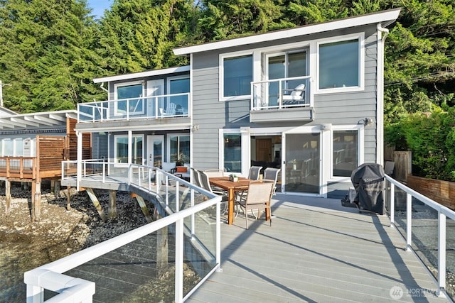 9451 E State Route 106, Union, WA 98592 - back of house with a balcony, a wooden deck, and outdoor dining space