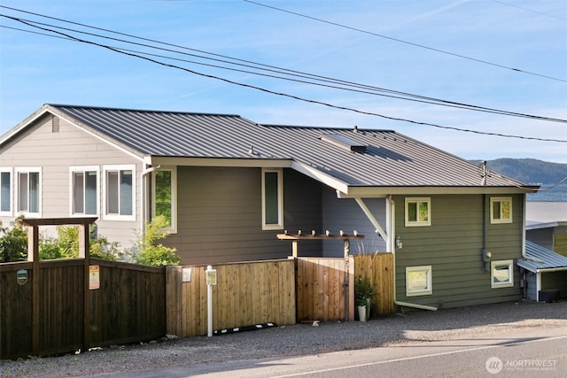 9451 E State Route 106, Union, WA 98592 - view of front of home with a standing seam roof, metal roof, and a mountain view