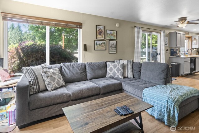 11420 232nd Avenue Ct E, Buckley, WA 98321 - living area featuring light wood-style flooring and a ceiling fan