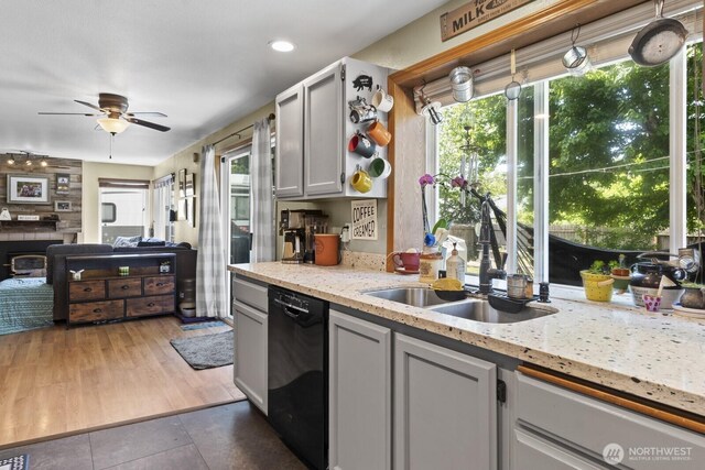 11420 232nd Avenue Ct E, Buckley, WA 98321 - kitchen with a sink, black dishwasher, ceiling fan, and plenty of natural light