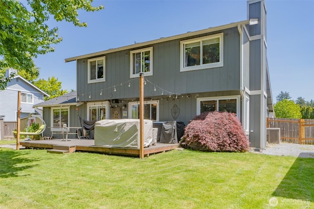 11420 232nd Avenue Ct E, Buckley, WA 98321 - rear view of house with a deck and a chimney