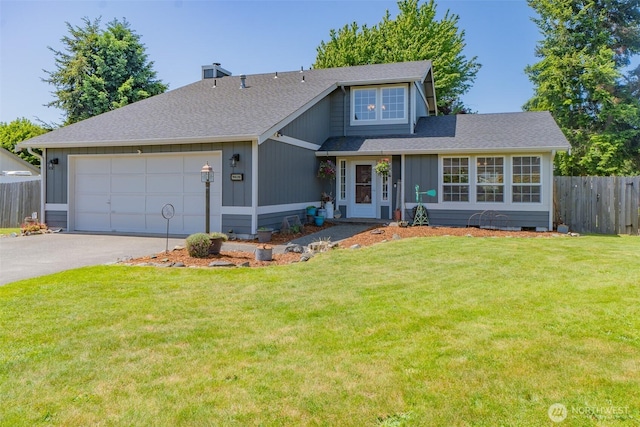 11420 232nd Avenue Ct E, Buckley, WA 98321 - view of front of property featuring driveway, an attached garage, roof with shingles, and a chimney