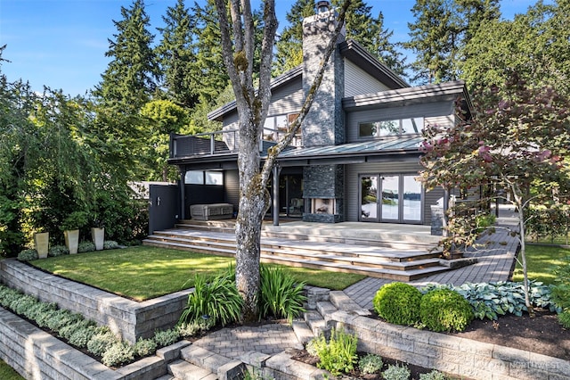 7708 Walnut St SW, Lakewood, WA 98498 - back of house with a yard, a balcony, a deck, a standing seam roof, and a metal roof