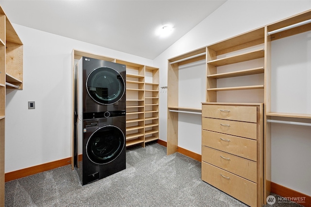 7708 Walnut St SW, Lakewood, WA 98498 - walk in closet with stacked washing machine and dryer, carpet flooring, and lofted ceiling