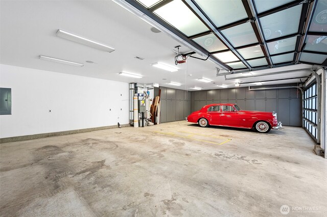 7708 Walnut St SW, Lakewood, WA 98498 - garage featuring electric panel and a garage door opener