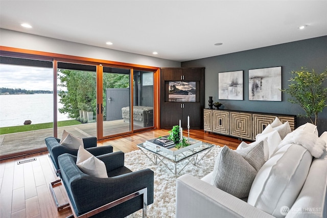 7708 Walnut St SW, Lakewood, WA 98498 - living room with wood finished floors, recessed lighting, and a water view