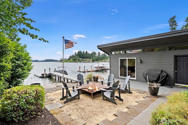 7708 Walnut St SW, Lakewood, WA 98498 - view of patio / terrace featuring a boat dock, an outdoor fire pit, and a water view