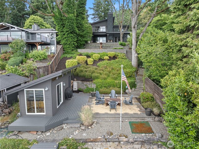 7708 Walnut St SW, Lakewood, WA 98498 - view of yard featuring a wooden deck, an outdoor fire pit, and stairs