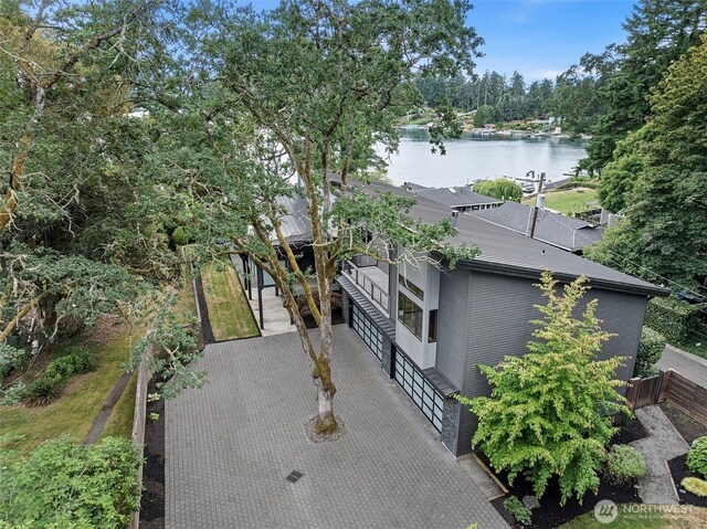 7708 Walnut St SW, Lakewood, WA 98498 - view of side of home featuring driveway, a water view, and an attached garage
