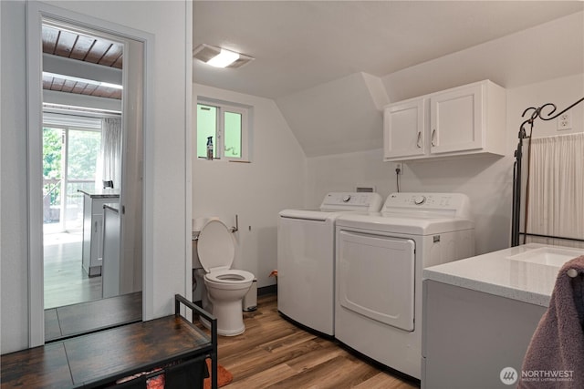 1741 NE Tahuya River Dr, Tahuya, WA 98588 - washroom with washing machine and dryer, wood finished floors, and a sink
