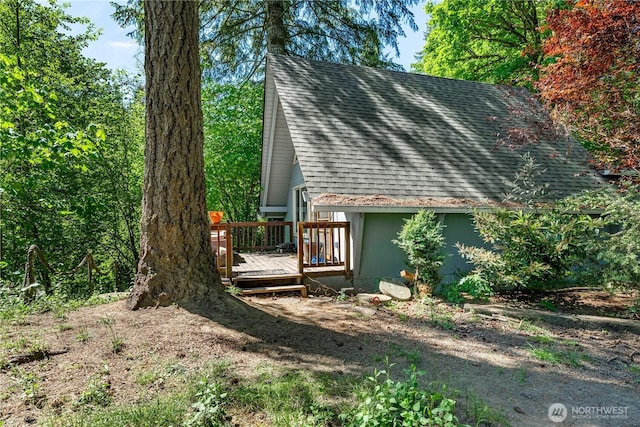 1741 NE Tahuya River Dr, Tahuya, WA 98588 - view of side of property featuring roof with shingles and a wooden deck