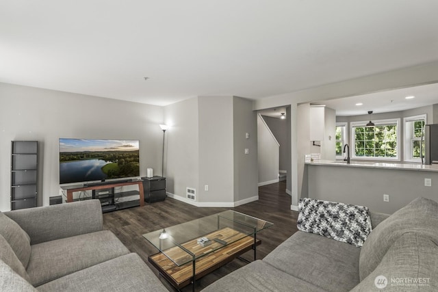 13629 26th Pl W Unit B104, Lynnwood, WA 98087 - living area with dark wood-type flooring, baseboards, and recessed lighting