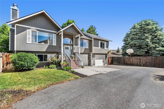 1324 Fairhaven Ave, Wenatchee, WA 98801 - raised ranch with driveway, a garage, and a chimney